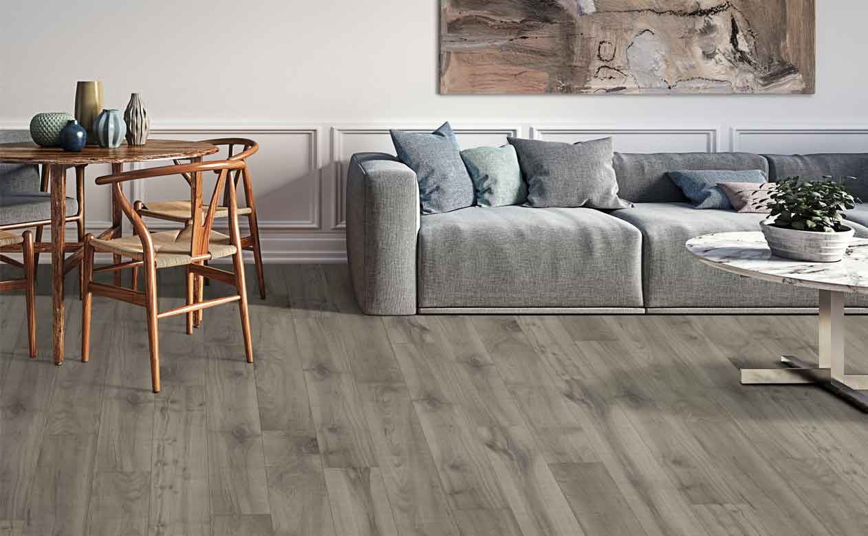 grey wood look laminate floors in a living and dining area