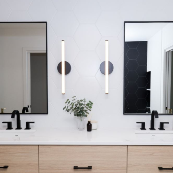 Living room with soft grey and cream furniture and carpet.
