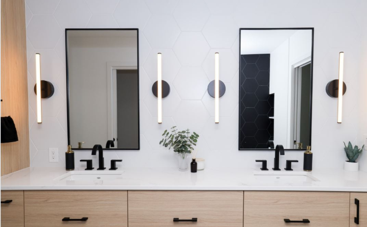 Living room with soft grey and cream furniture and carpet.
