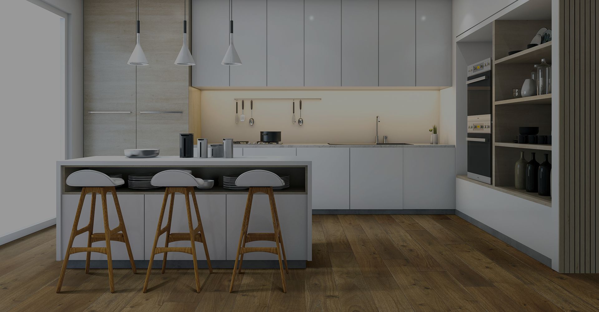 A kitchen with white cabinets and countertops and wood floors.